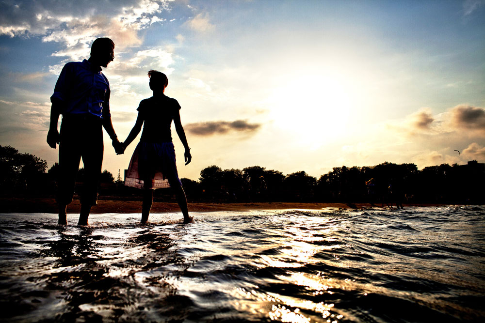 Silhouette of couple in the water on Lake Michigan