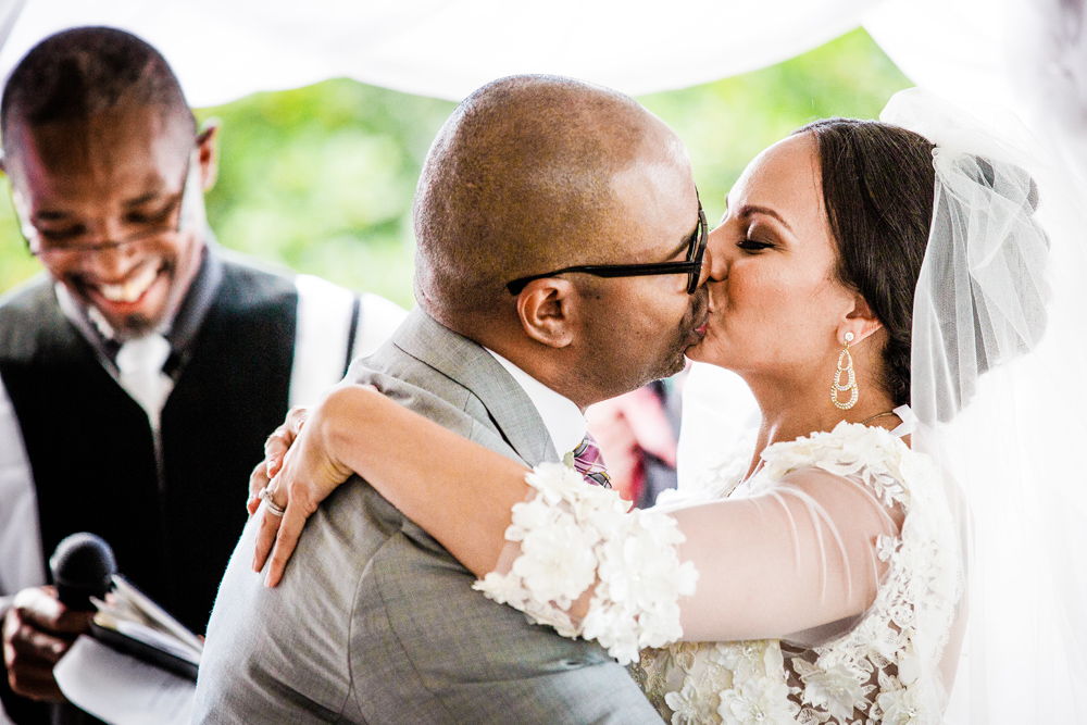 Bride and groom's first kiss during a Promontory Point wedding ceremony
