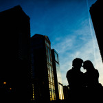 couple silhouetted on the Wabash Bridge during their downtown Chicago engagement session