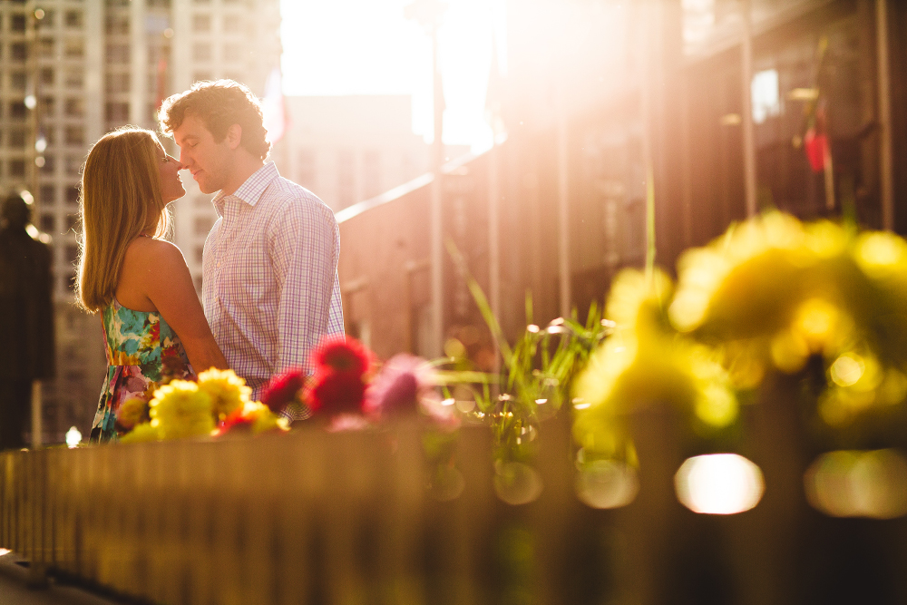 A couple kisses during their wrigley building engagement session 