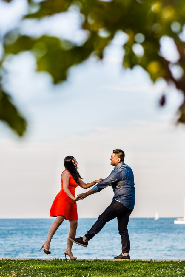 Couple dances along the dock during their Belmont Harbor engagement session
