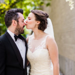 Bride and groom kiss before their Ovation Chicago wedding.