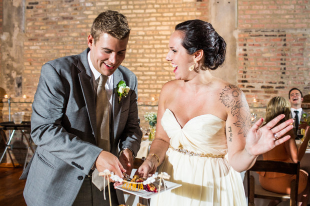 Bride and groom cut the cake at a Ravenswood Event Center wedding.