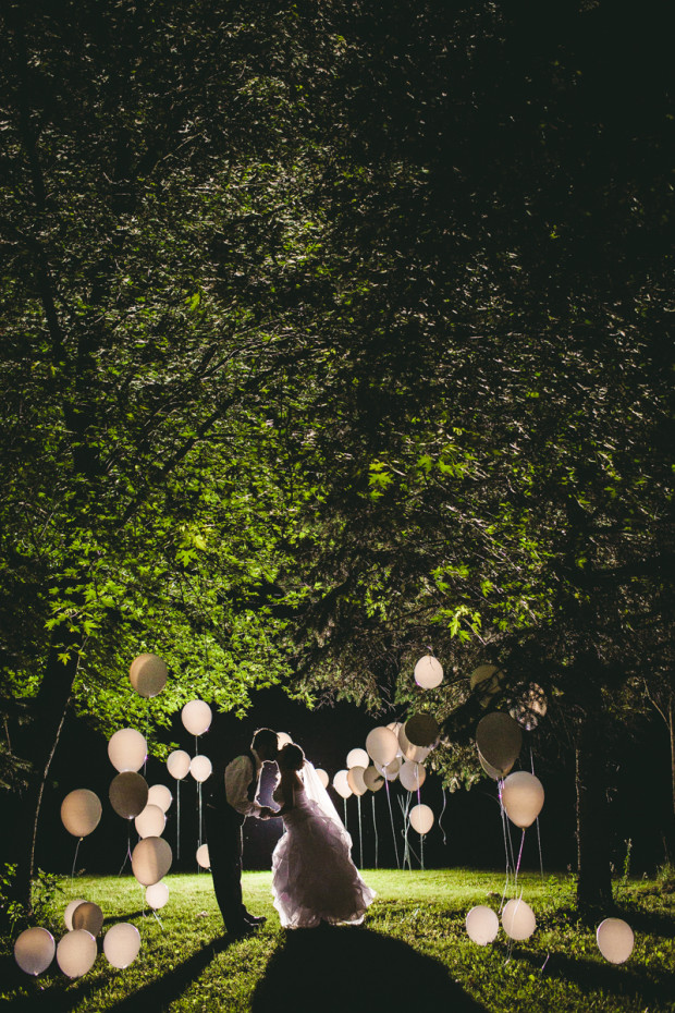 Bride and groom portrait at night during a Wisconsin backyard wedding
