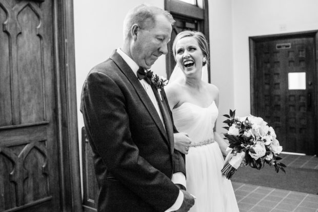 Bride laughs with her father before her wedding ceremony to start at Sacred Heart Church in Winnetka.