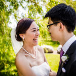 Couple laughs together in Ping Tom Park before their Greenhouse Loft wedding.
