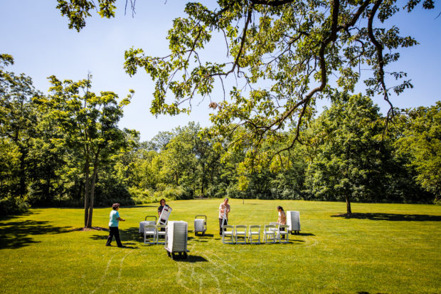 Vendors set up the ceremony during a wedding at The Grove.