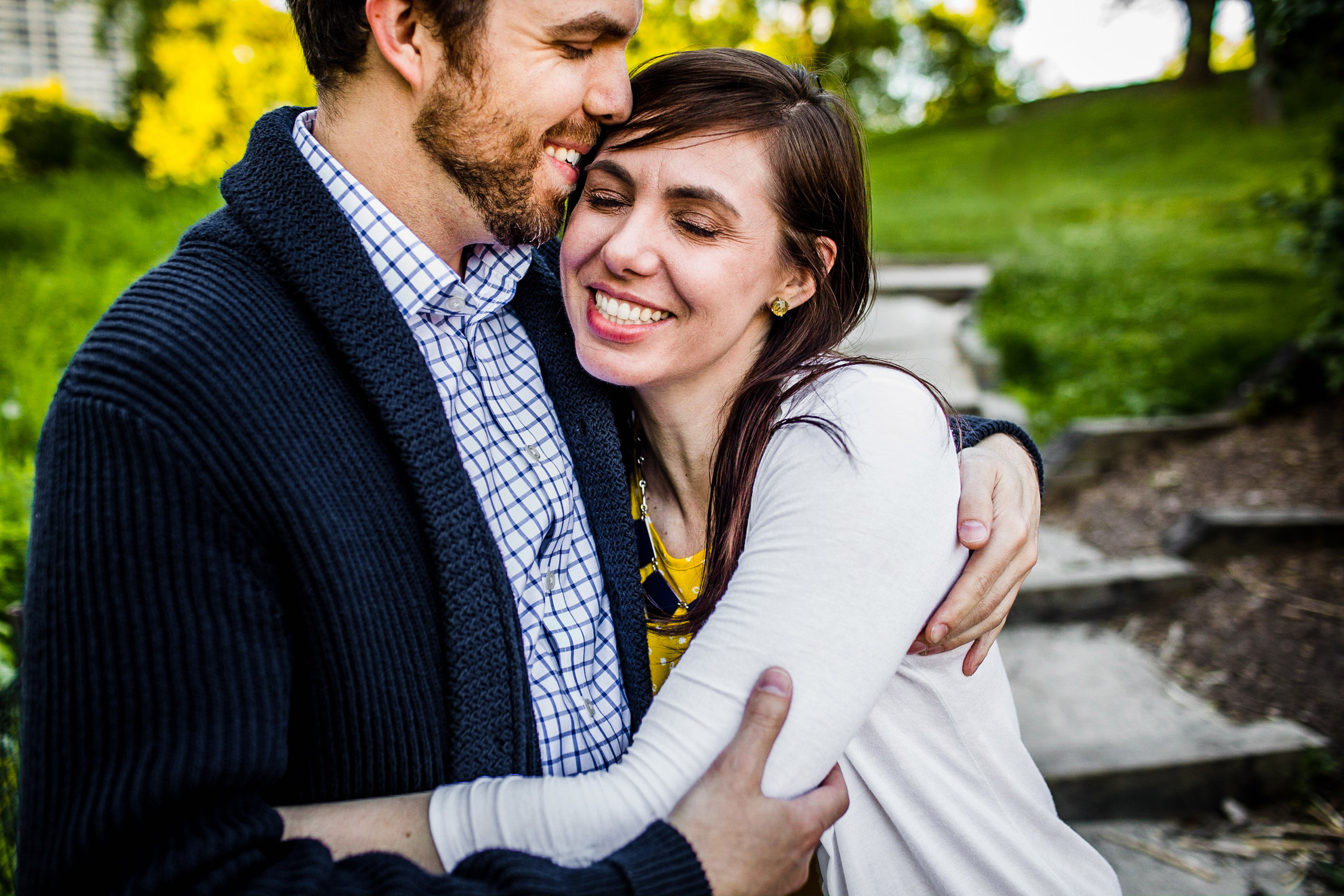A couple laughs together during their Lincoln Park engagement session.