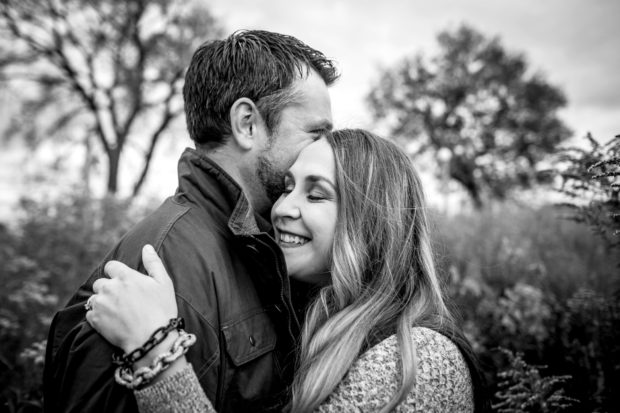 A couple embraces during their Lincoln Park engagement session.