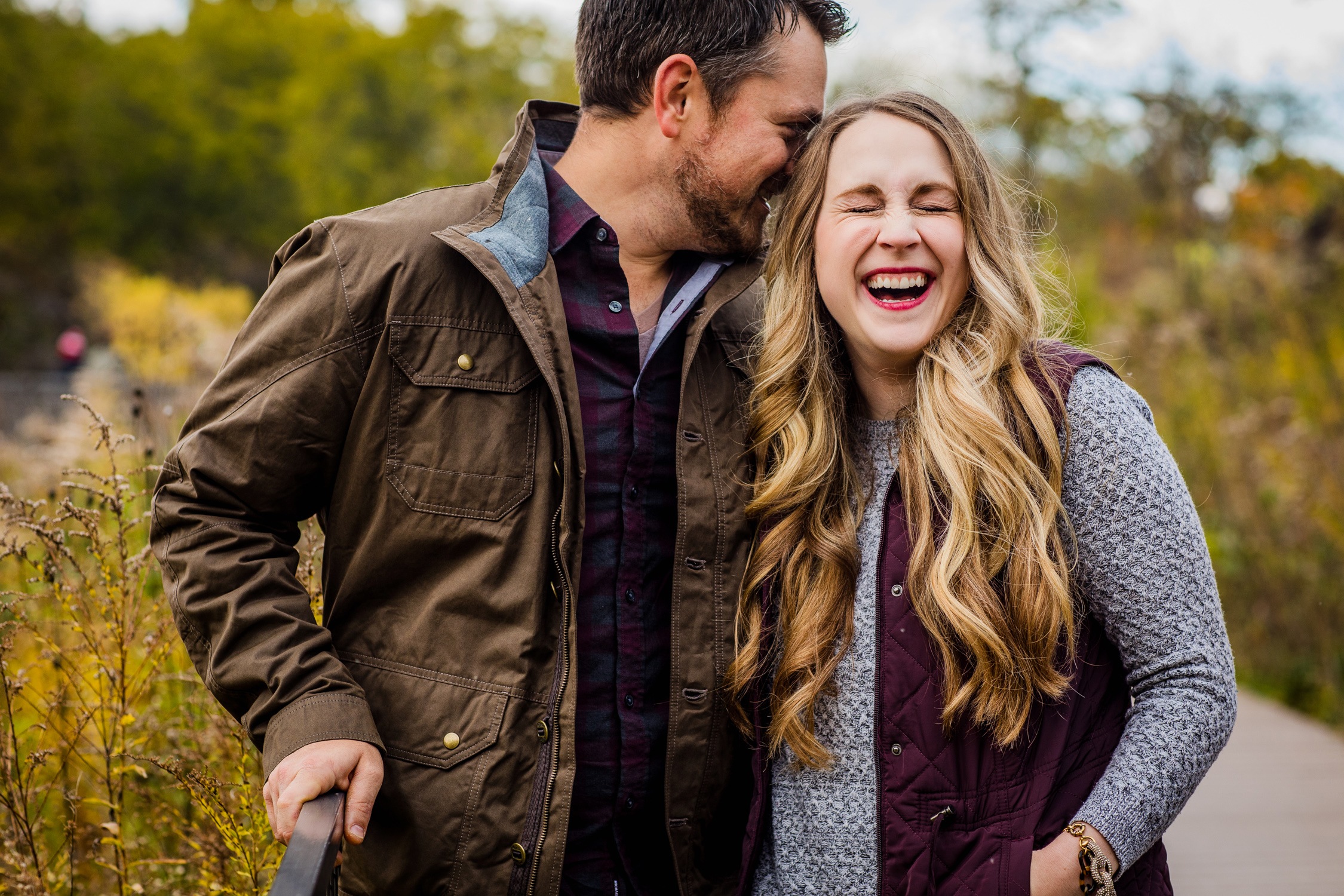 Couple laughs together during their Lincoln Park engagement session.