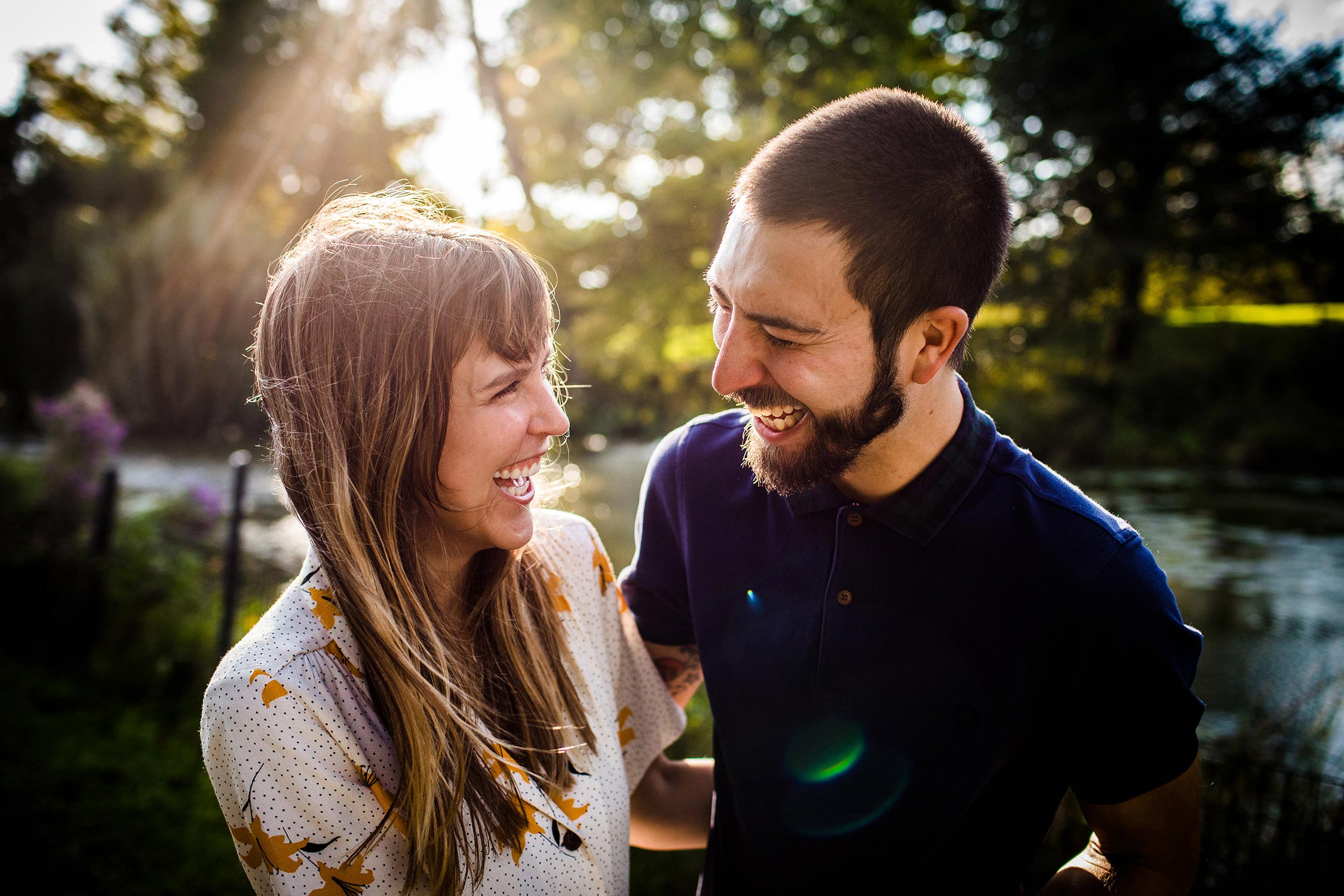 A couple laughs together during their Humboldt Park engagement session in Chicago.