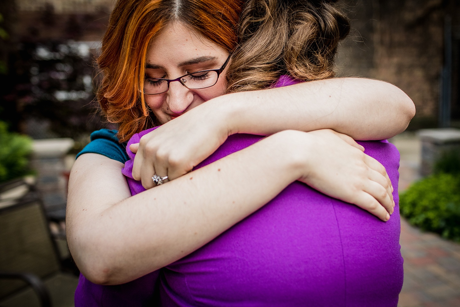 A couple hugs each other during their Andersonville engagement session. 