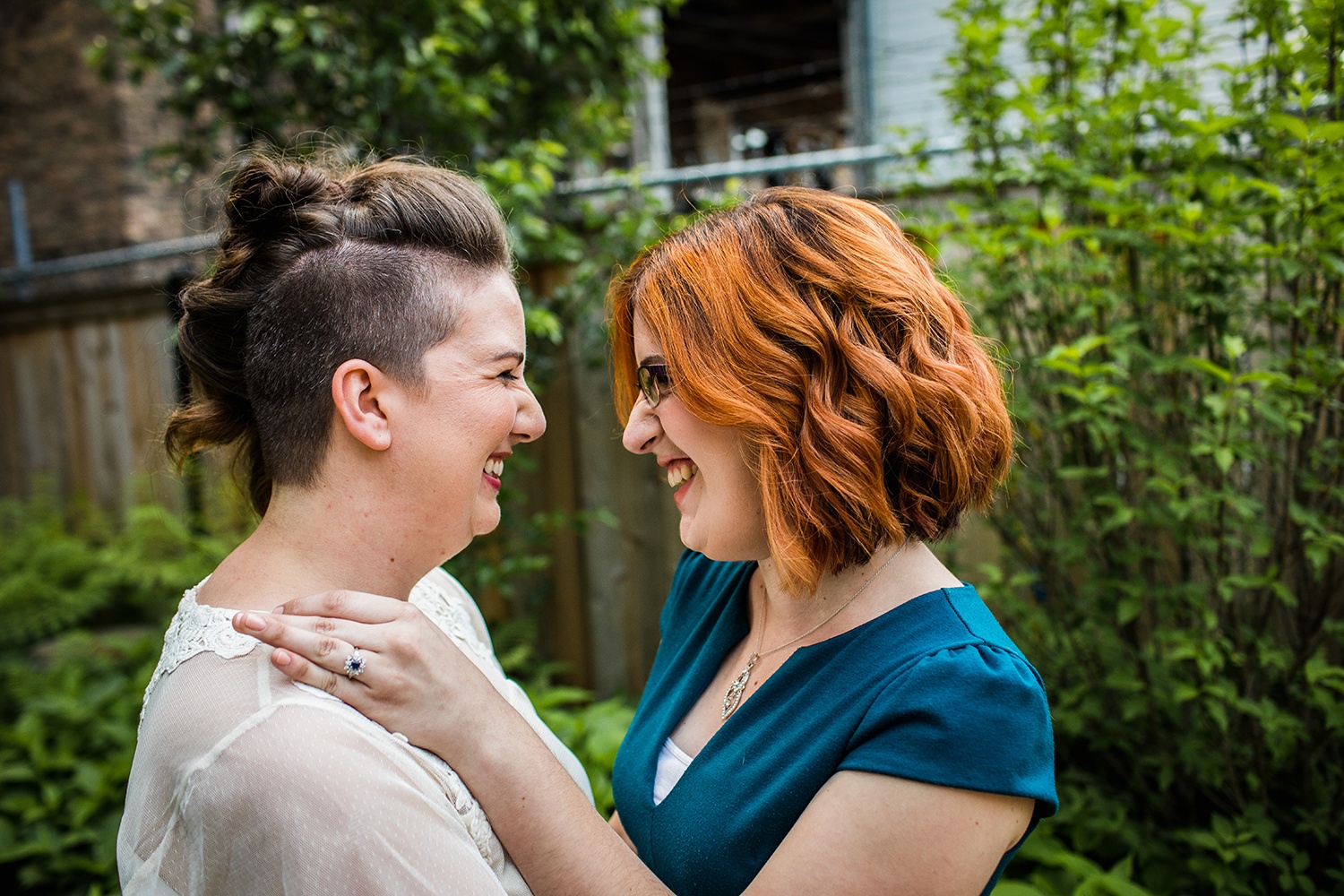 A couple laughs together during their Andersonville engagement session. 