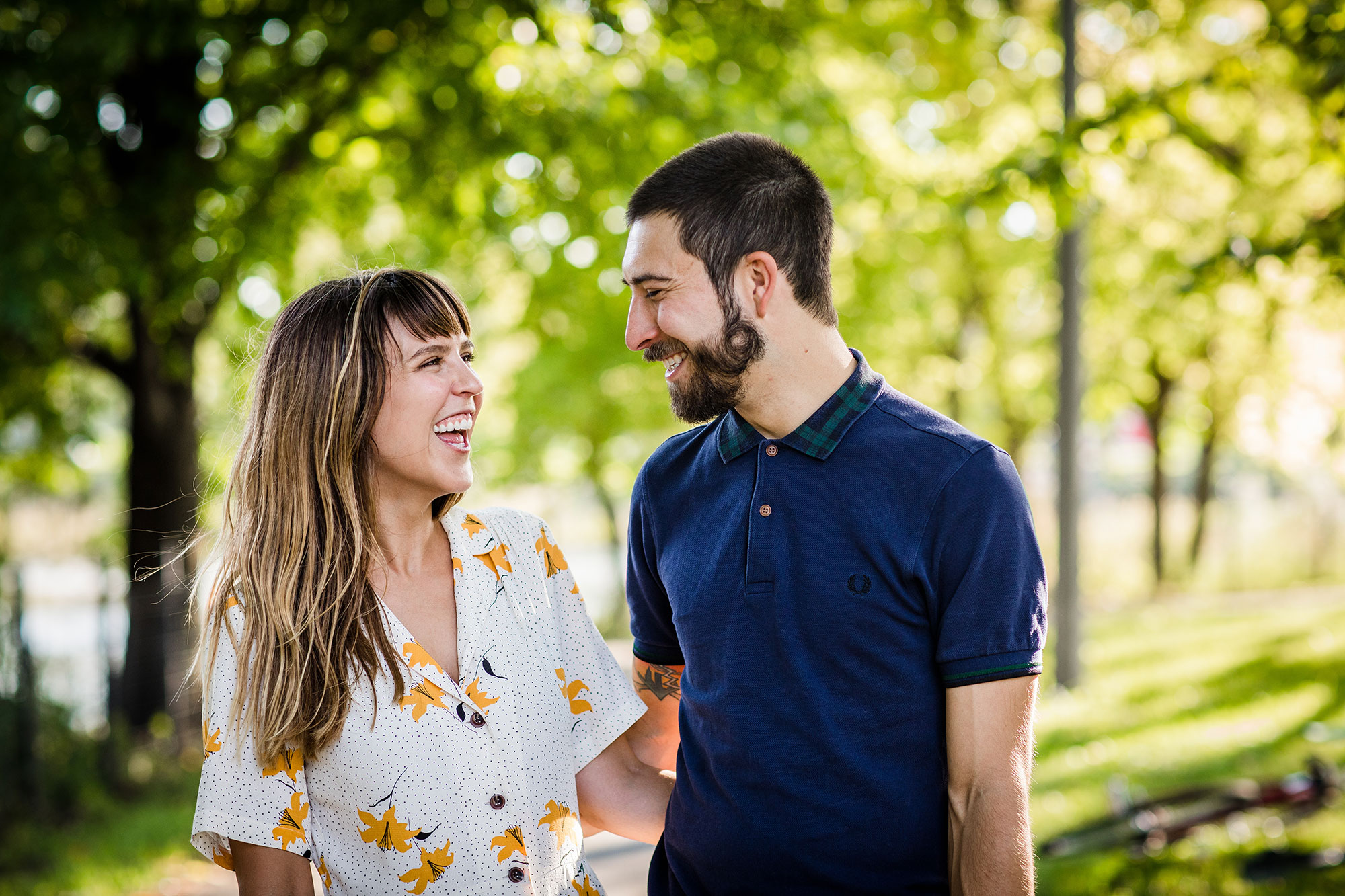 A couple laughs together during their Humboldt Park engagement session in Chicago.