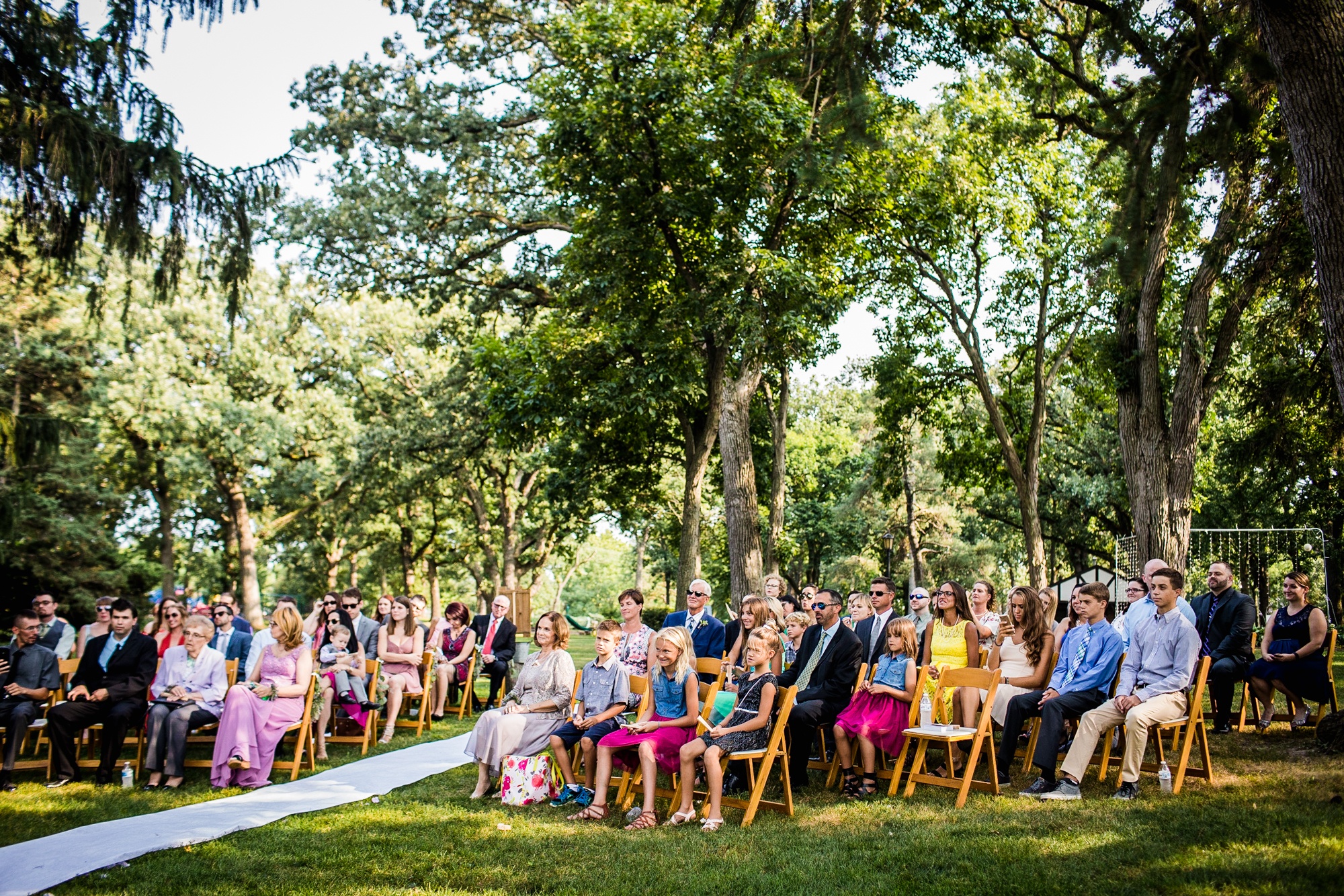 Guests watch a ceremony at a Katherine Legge Memorial lodge wedding