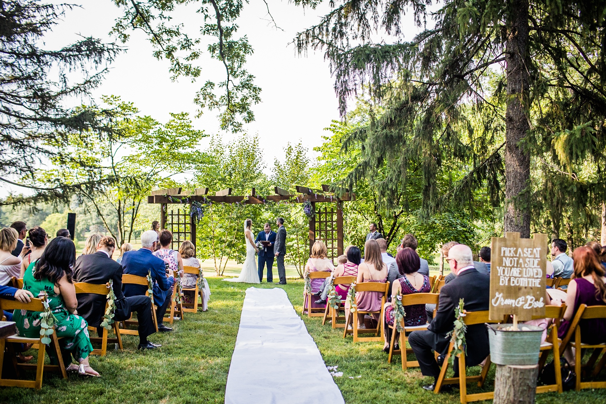 Guests watch a ceremony during a Katherine Legge Memorial lodge wedding