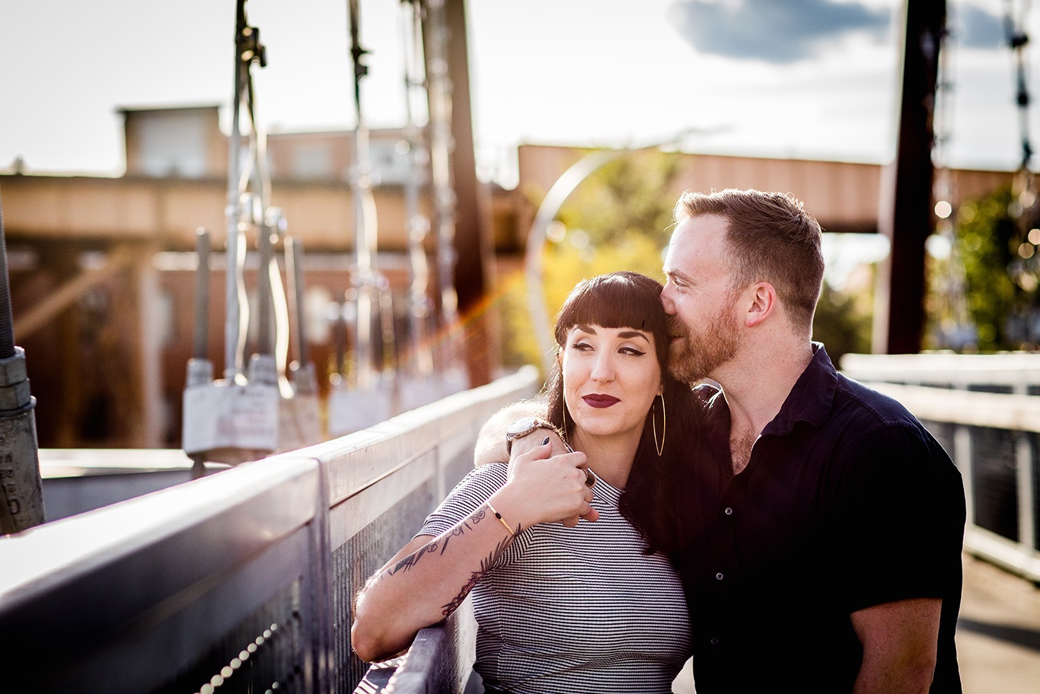 A couple shares a moment together on the 606 during their Logan Square engagement session in Chicago. 