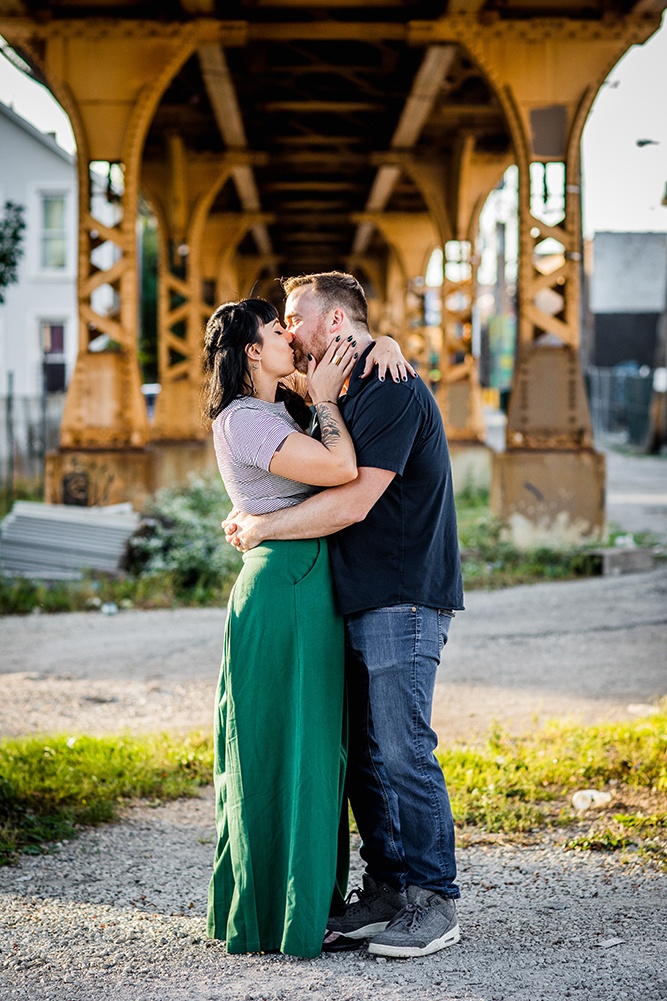 A couple kisses each other during their Logan Square engagement session in Chicago. 