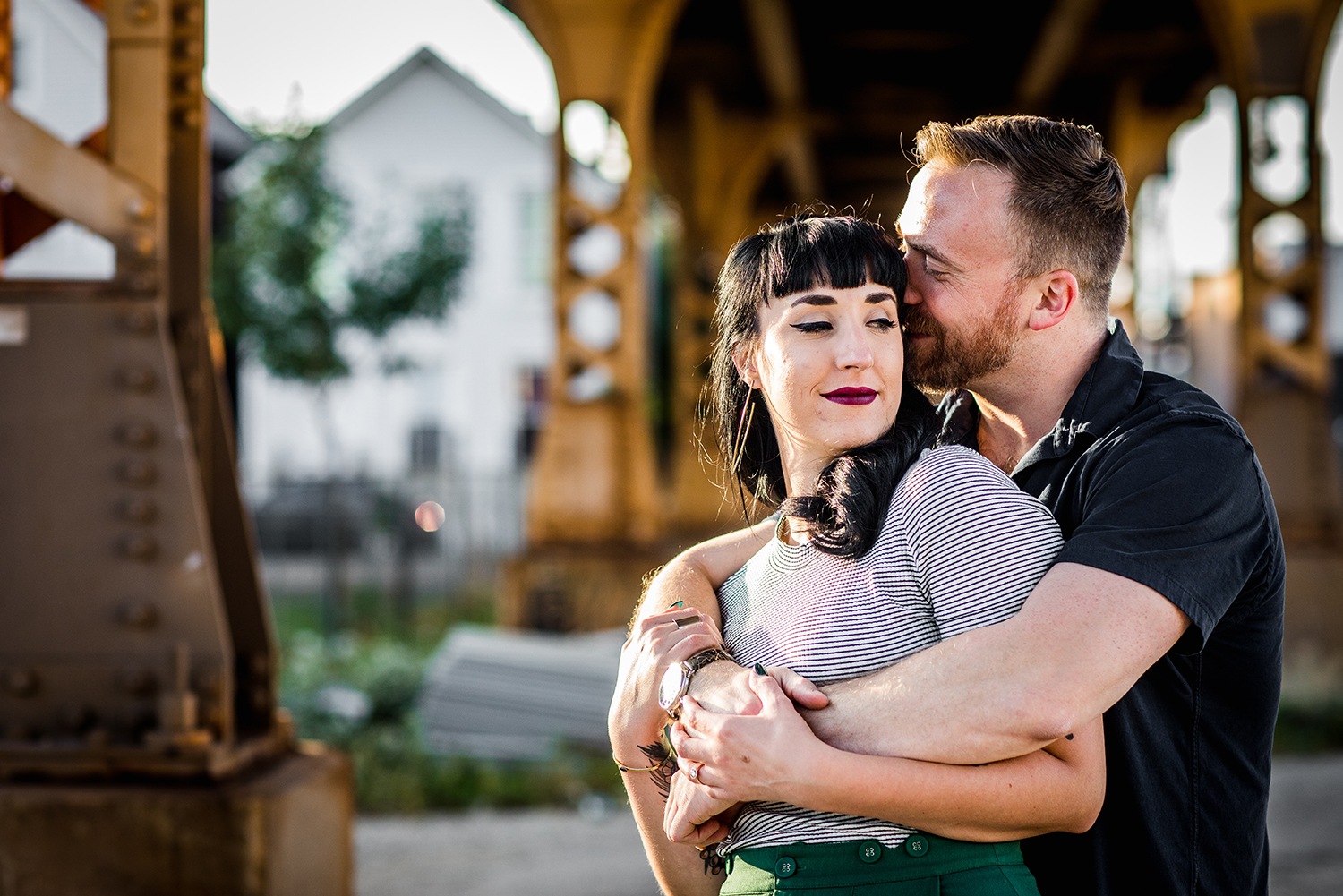 A couple hugs each other during their Logan Square engagement session in Chicago. 