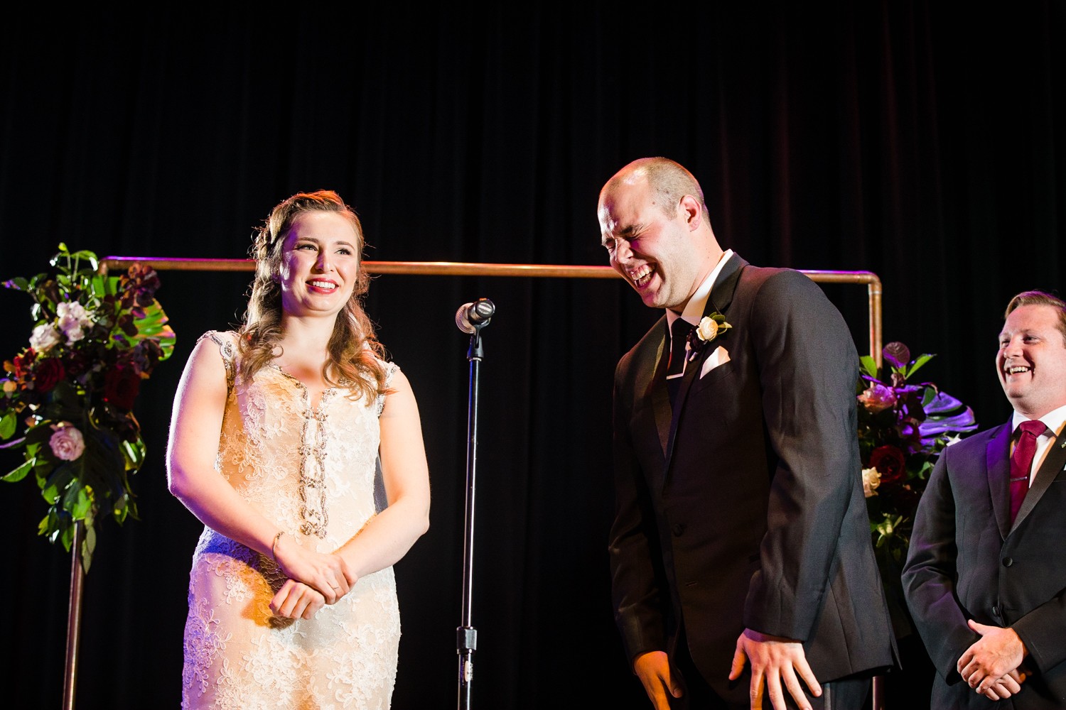 A bride and groom laugh with each other at a Mayne Stage wedding in Chicago. 