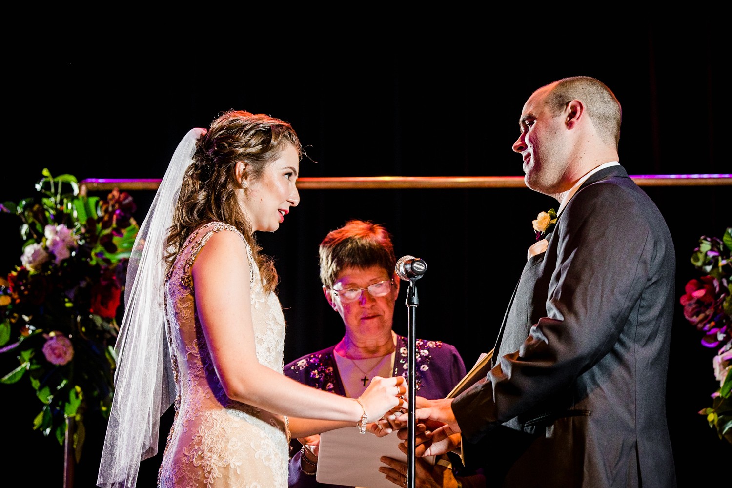 A couple exchanges their vows during a ceremony at a Mayne Stage wedding in Chicago. 