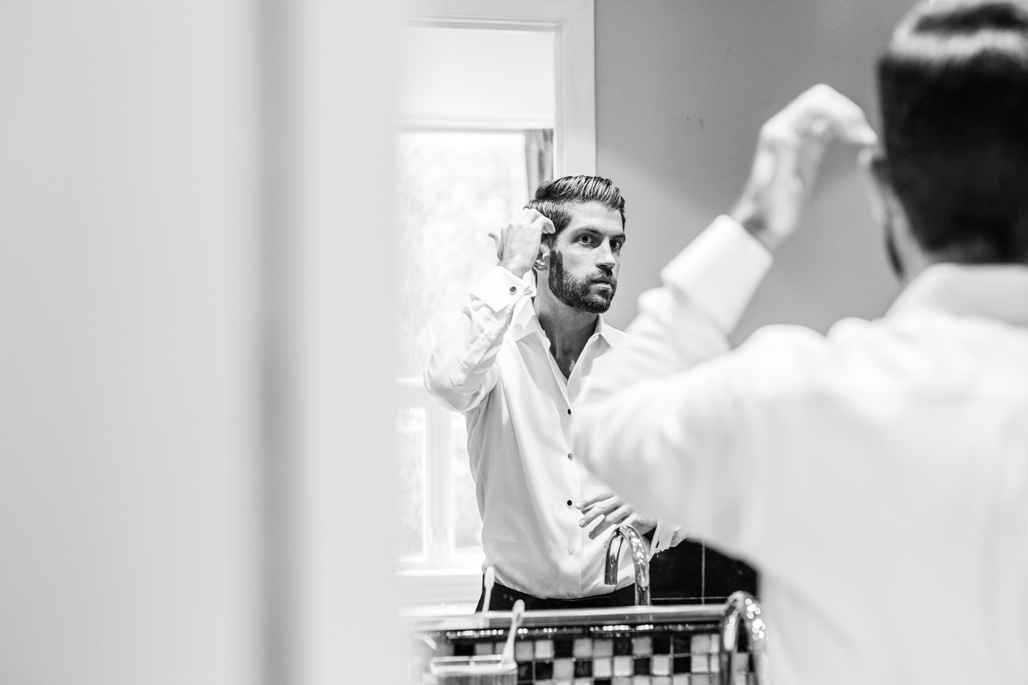 A groom gets ready before his Gallery Marchetti wedding.