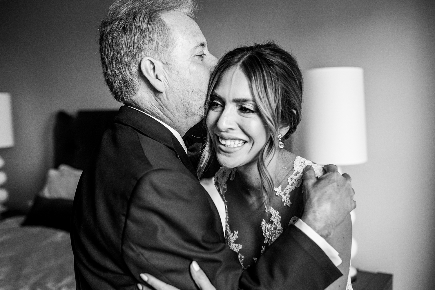 A bride shares a first look with her dad before a Gallery Marchetti wedding.