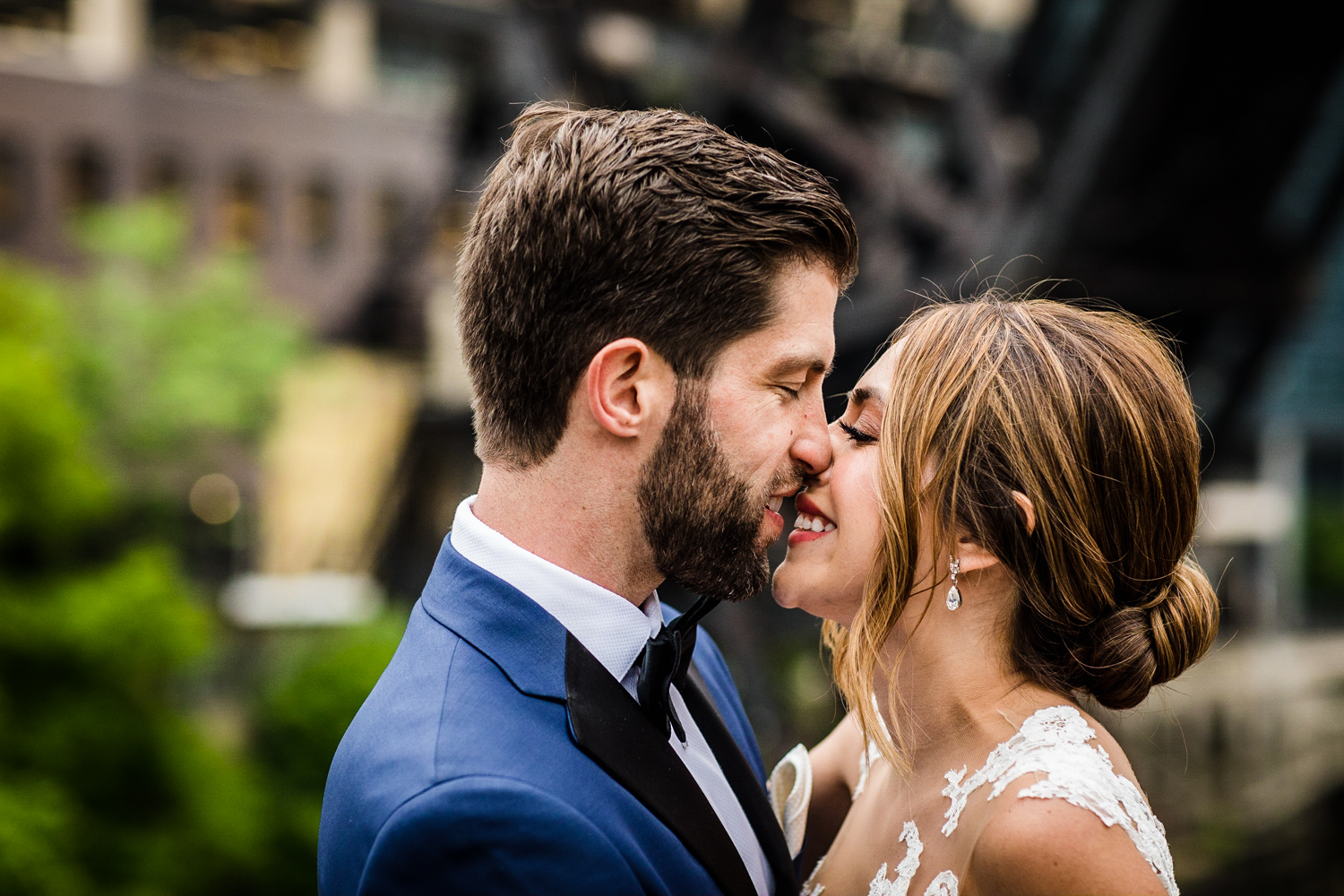 A bride and groom share a kiss before their Gallery Marchetti wedding.