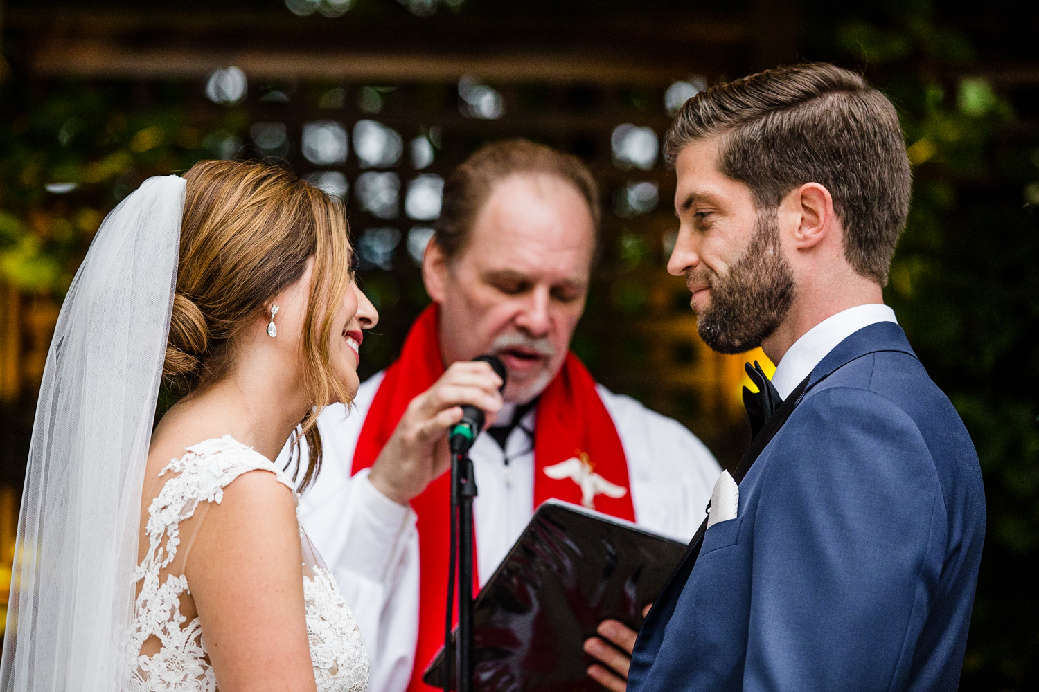 A bride and groom share their wedding vows during a Gallery Marchetti wedding ceremony.