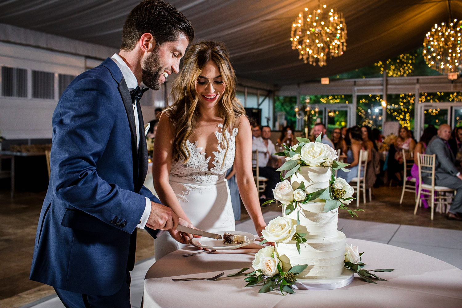 A couple cuts their cake during a Gallery Marchetti wedding.