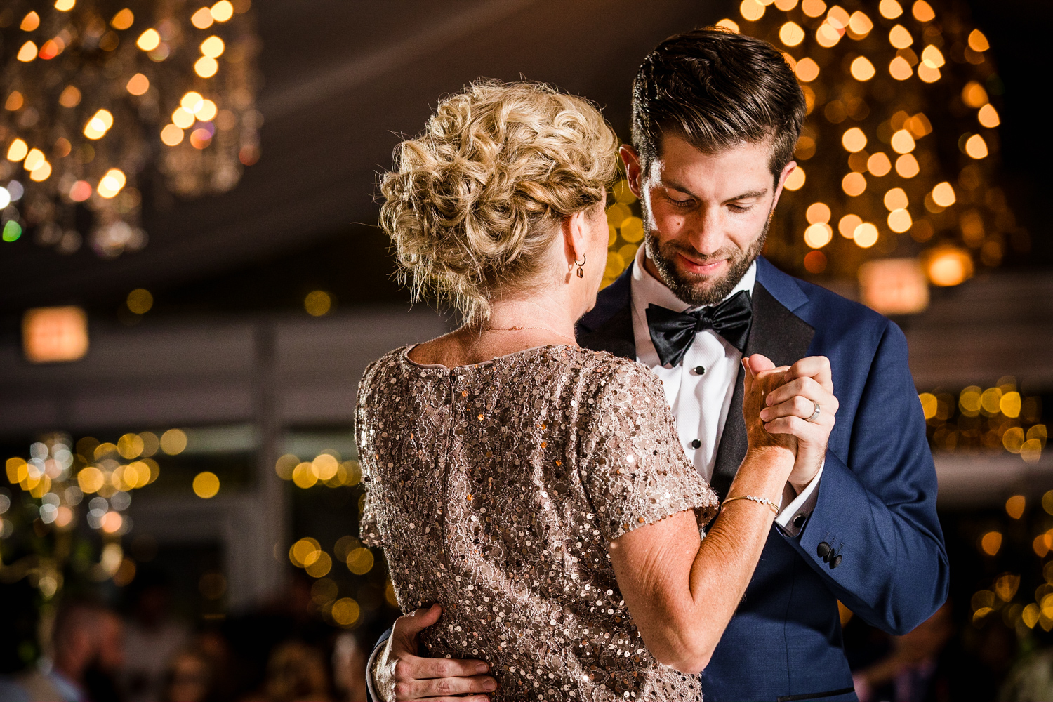 A groom dances with his mom during a Gallery Marchetti wedding.