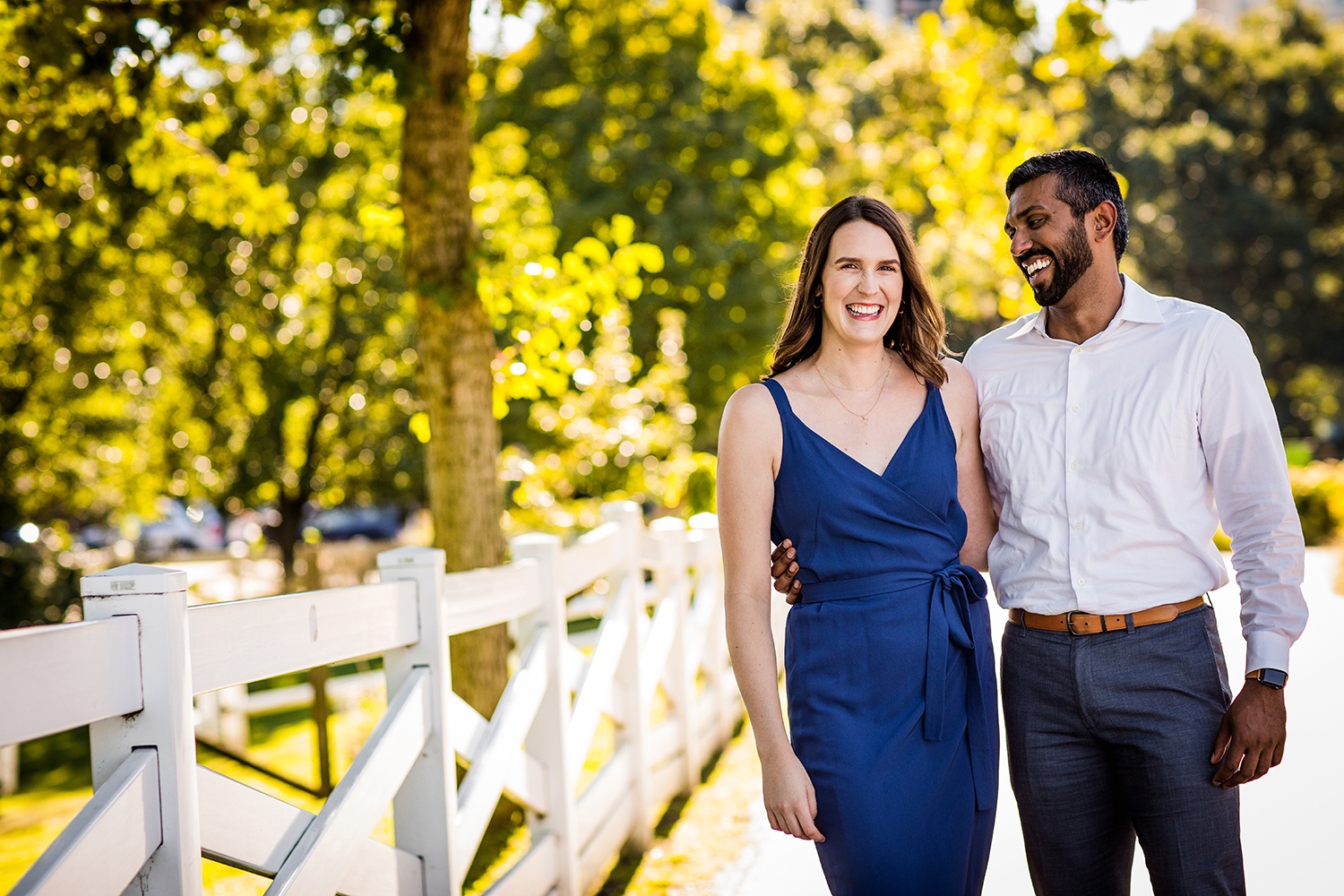 A couple laughs together during their Lincoln Park engagement session.
