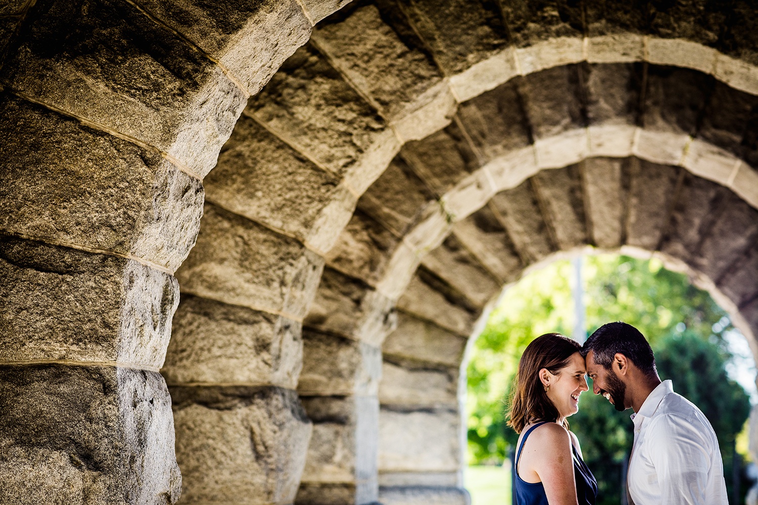 A couple laughs together during their Lincoln Park engagement session.