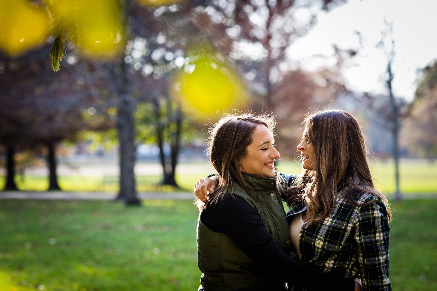 A couple laughs together during their Andersonville engagement session.