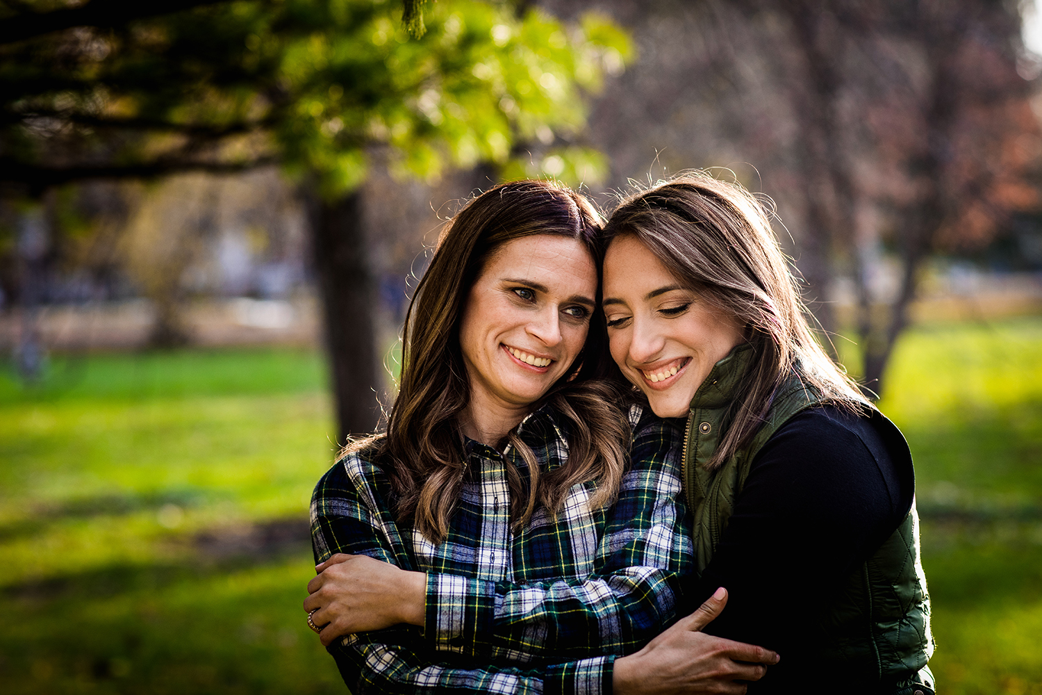 A couple hugs during their Andersonville engagement session in Chicago.