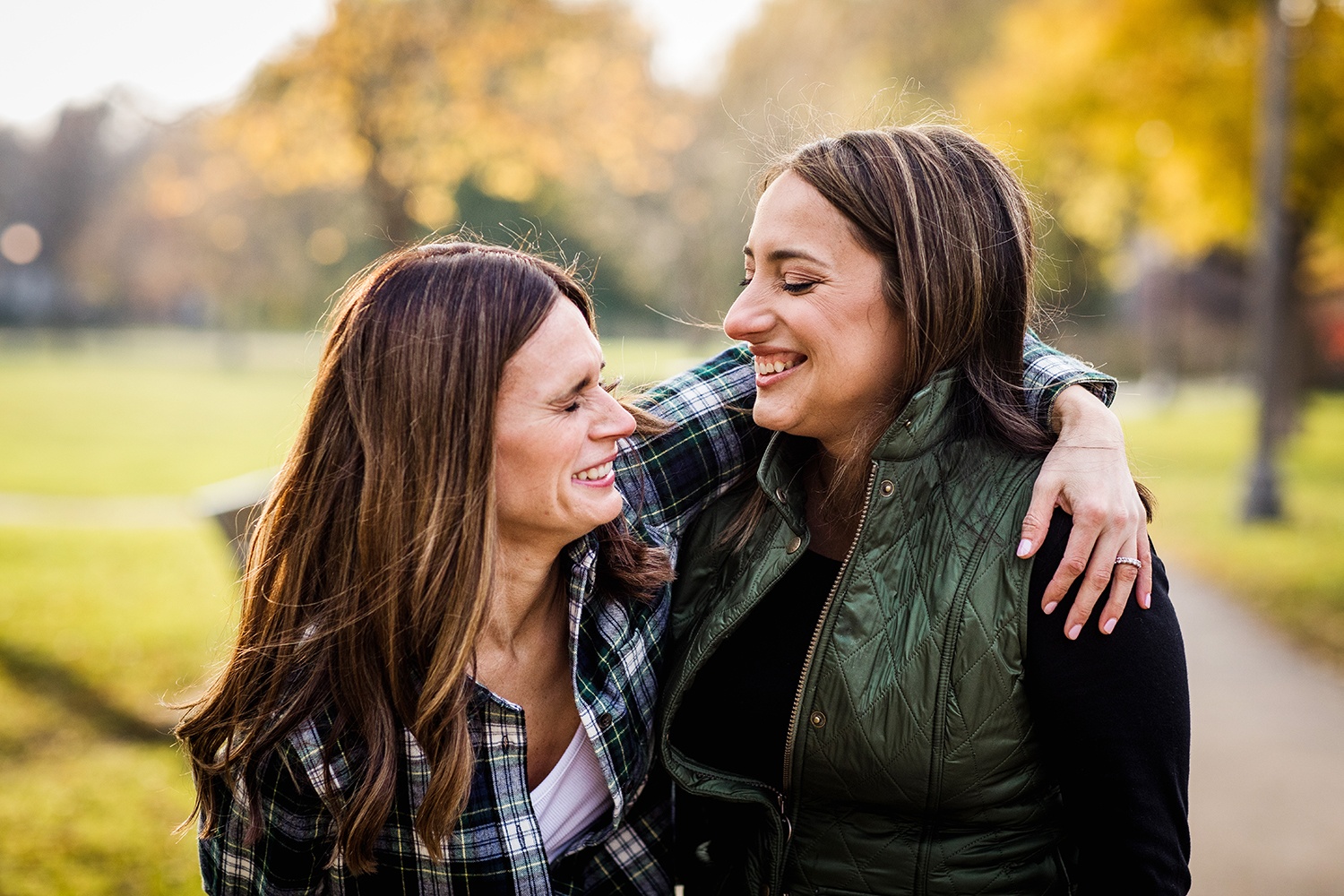 A couple laughs together during their Andersonville engagement session in Chicago. 