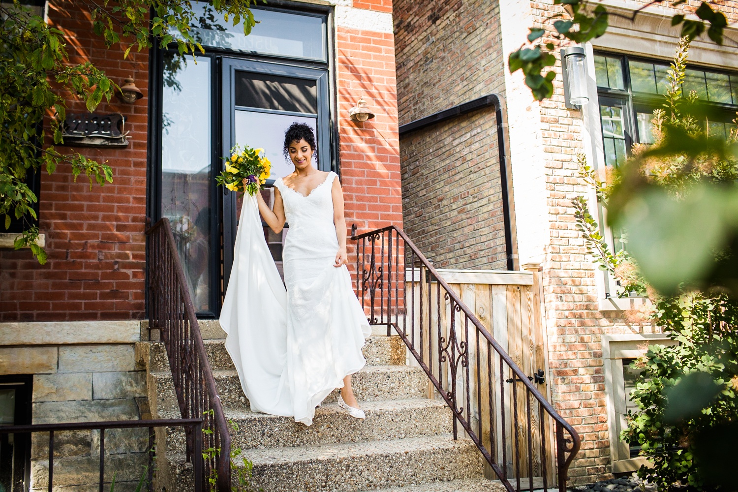 A bride walks down the stairs on her way to her Garfield Park Conservatory wedding.