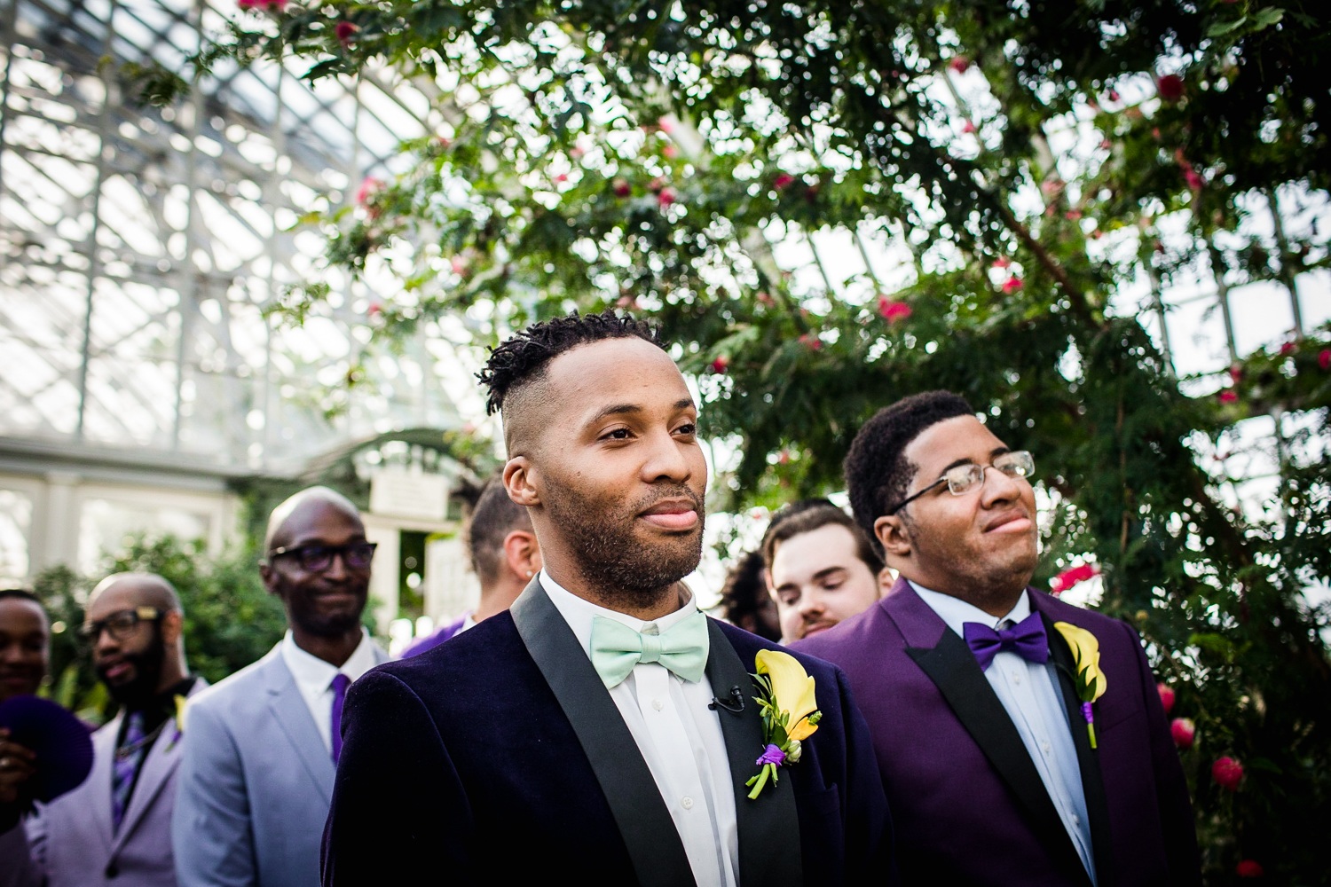 A groom reacts to seeing his bride walk down the aisle at a Garfield Park Conservatory wedding. 