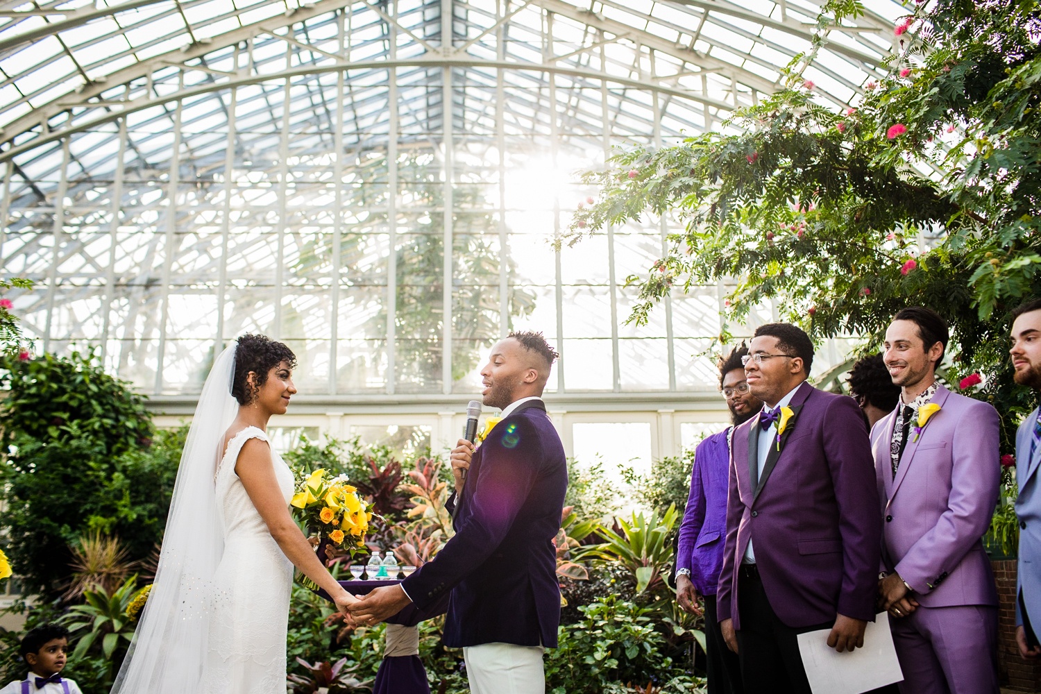 A groom sings a song to his bride during a Garfield Park Conservatory wedding.