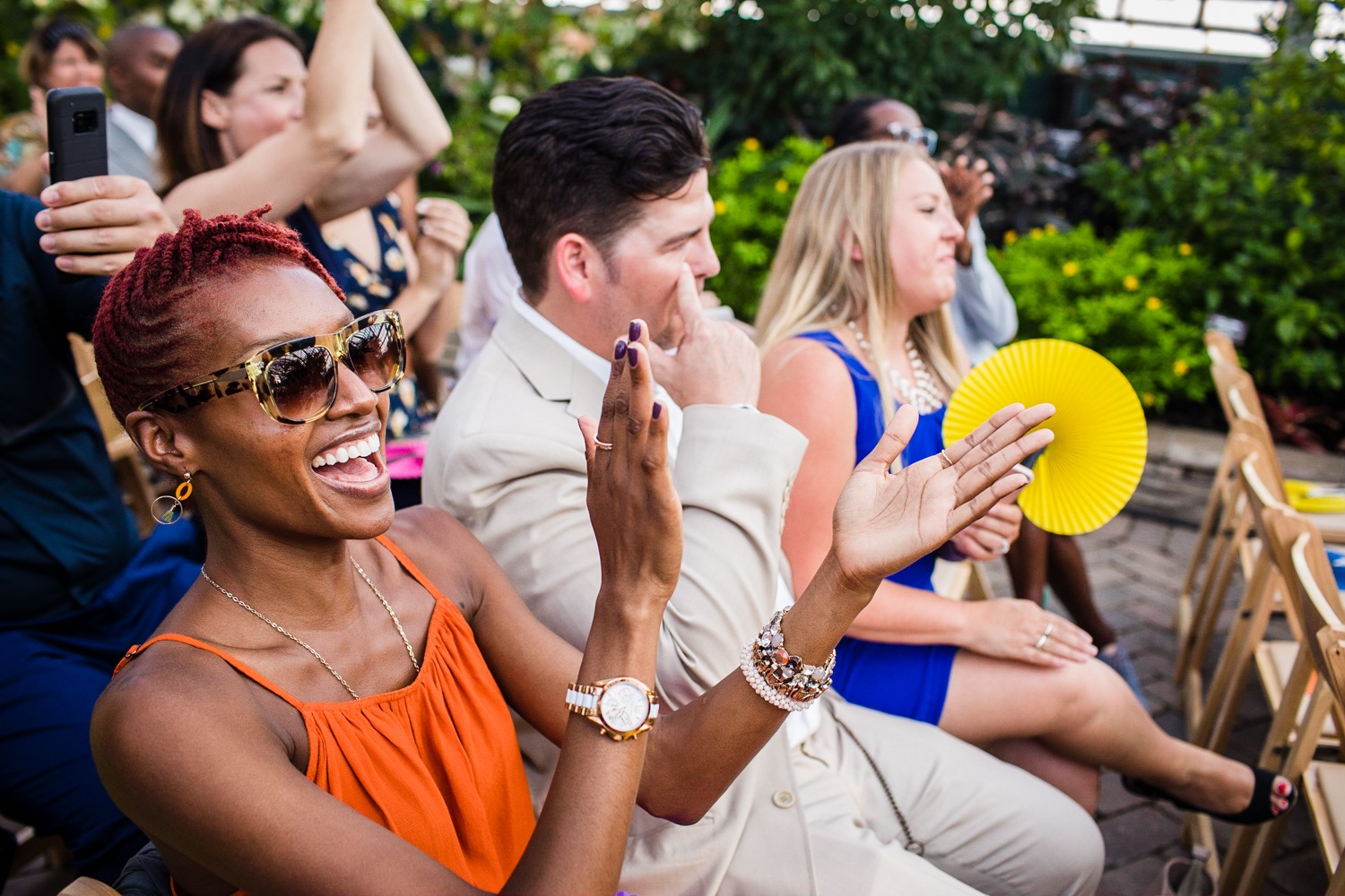 Guests react to a wedding ceremony at a Garfield Park Conservatory wedding.