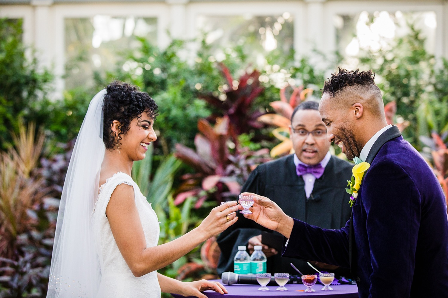 A couple participates in a tasting of the elements ceremony at a Garfield Park Conservatory wedding. 