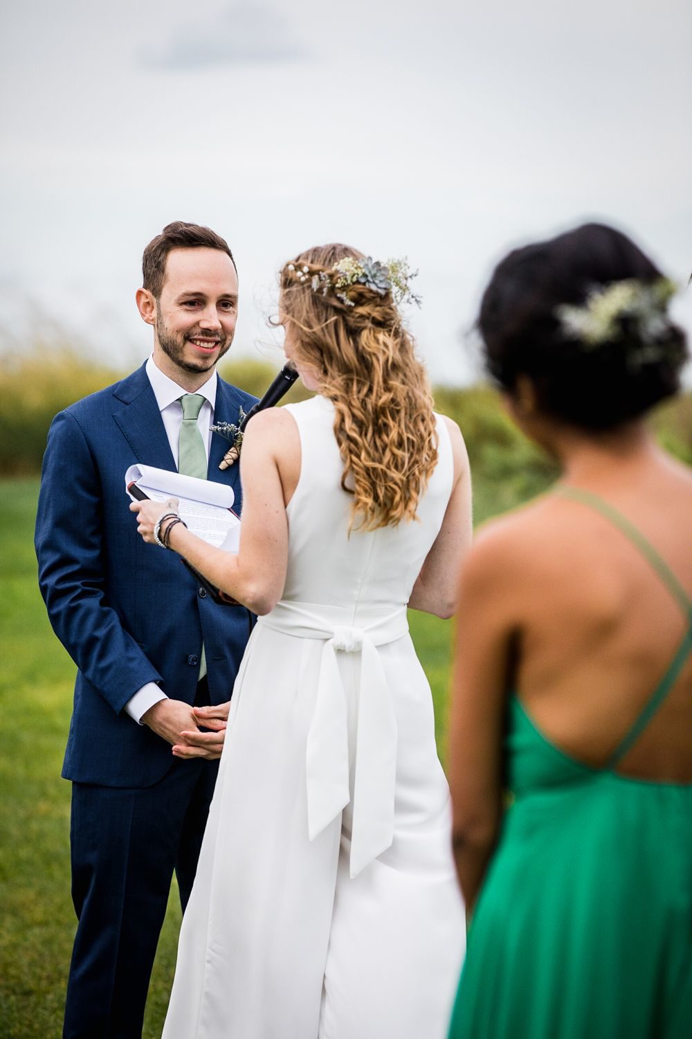 A groom reacts to his bride's vows during an Illinois Beach Resort wedding