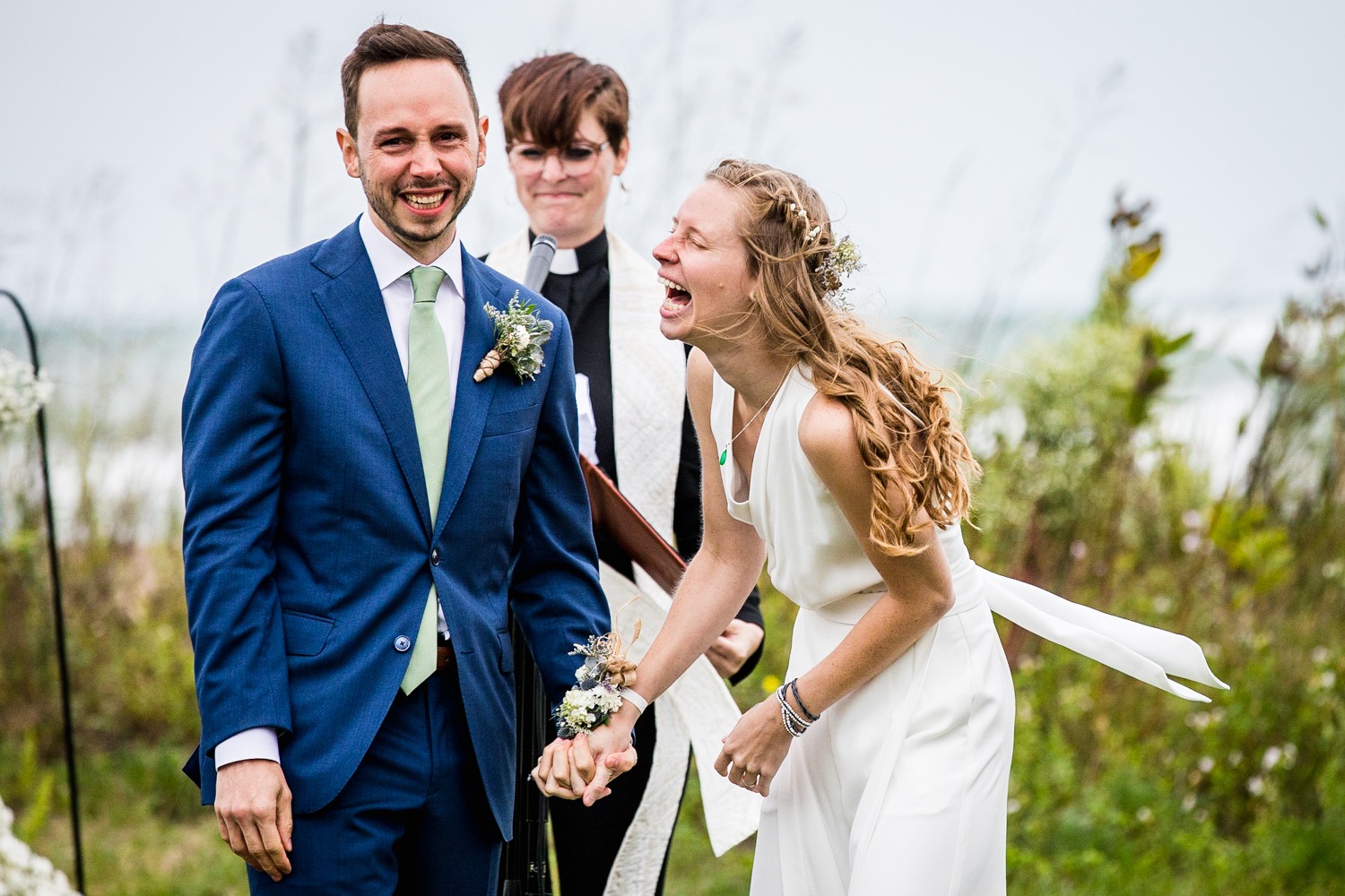 A couple reacts after exchanging their vows during an Illinois Beach Resort wedding ceremony