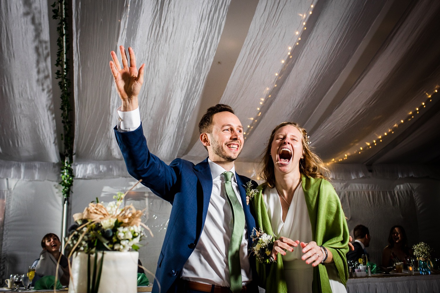 A couple laughs before their cake cutting at an Illinois Beach Resort wedding