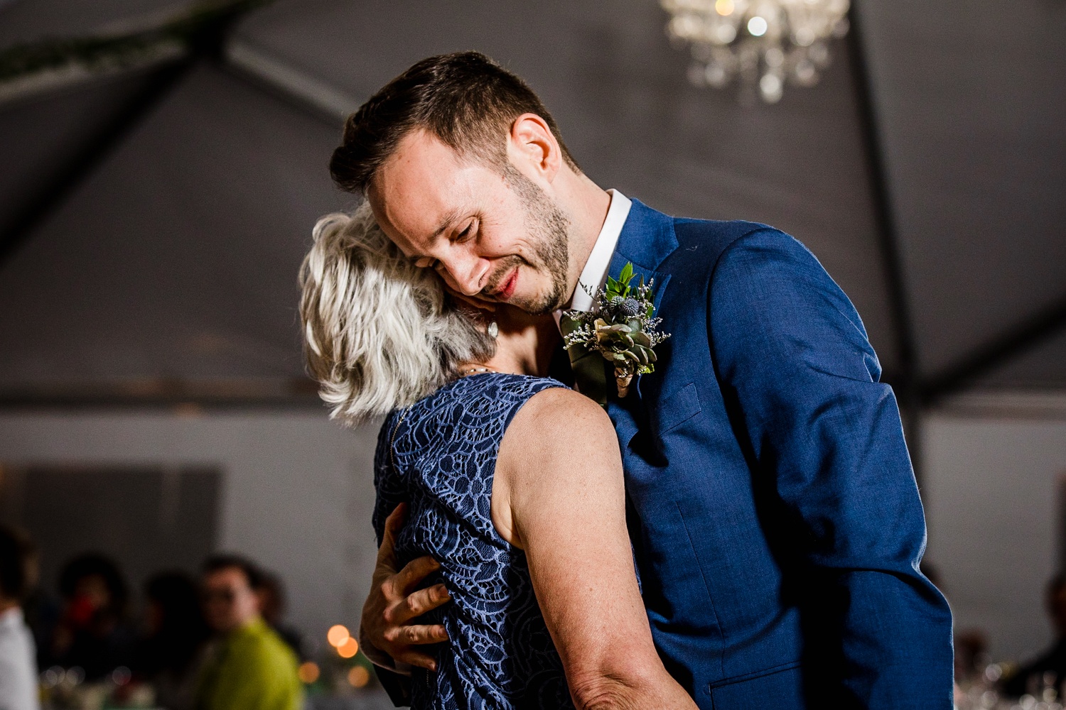 A groom shares a first dance with his mother at an Illinois Beach Resort wedding