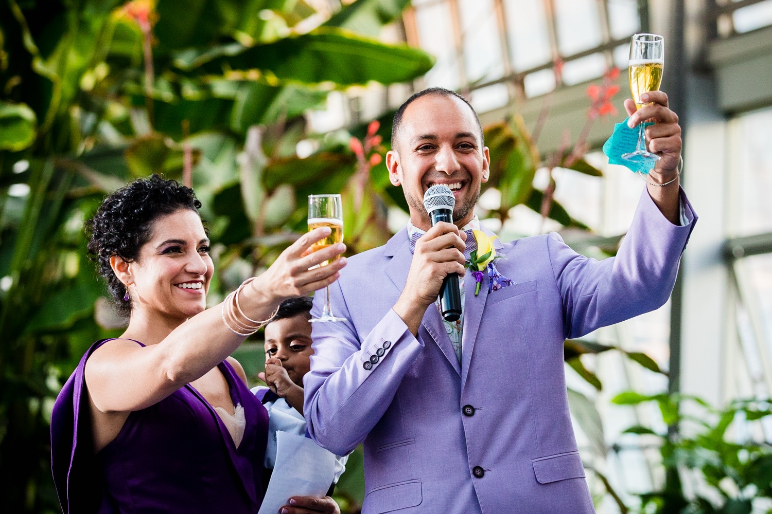 Members of the family give a toast at a Garfield Park Conservatory wedding. 