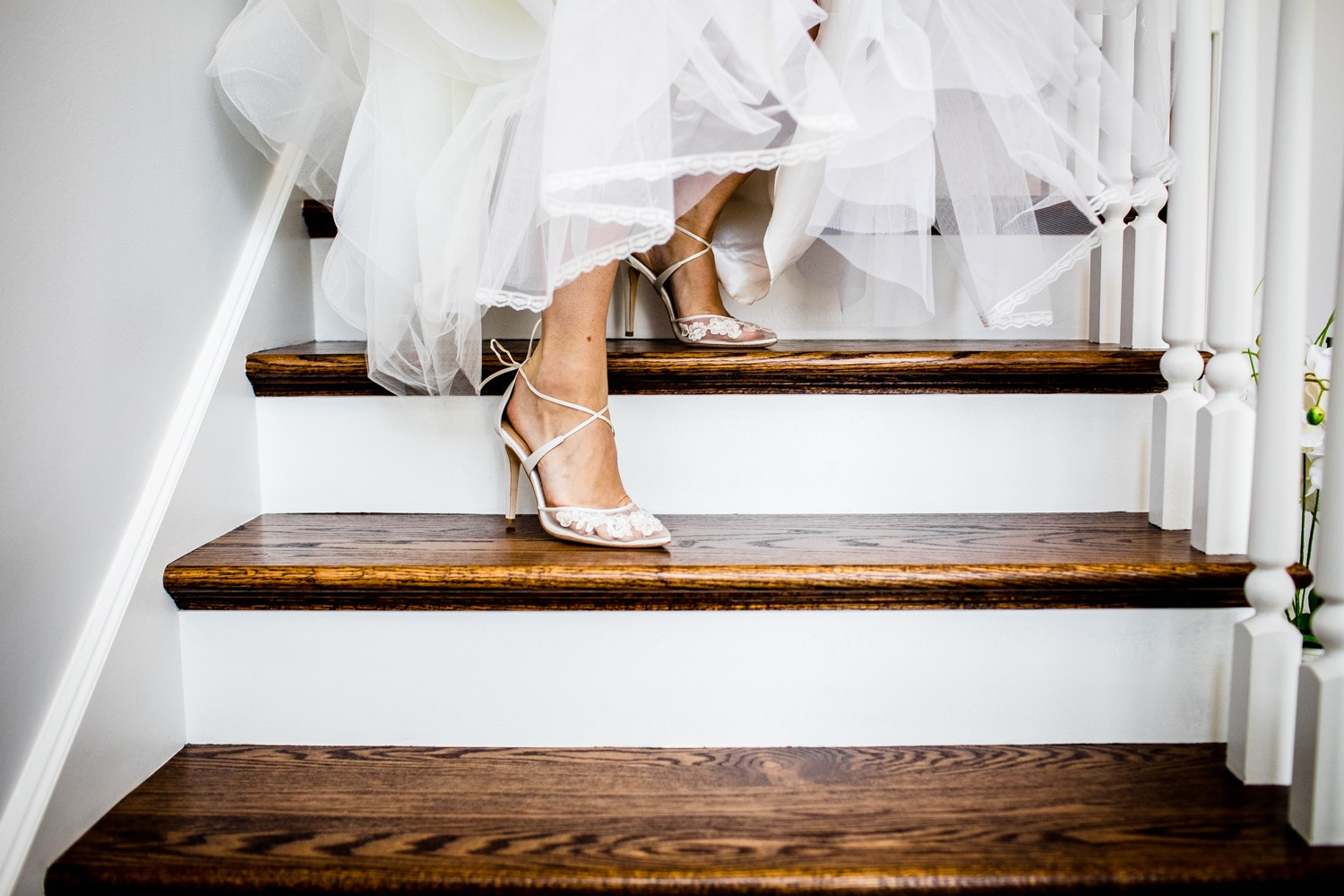 A bride walks down the stairs before her wedding at her home in the Chicago suburbs. 