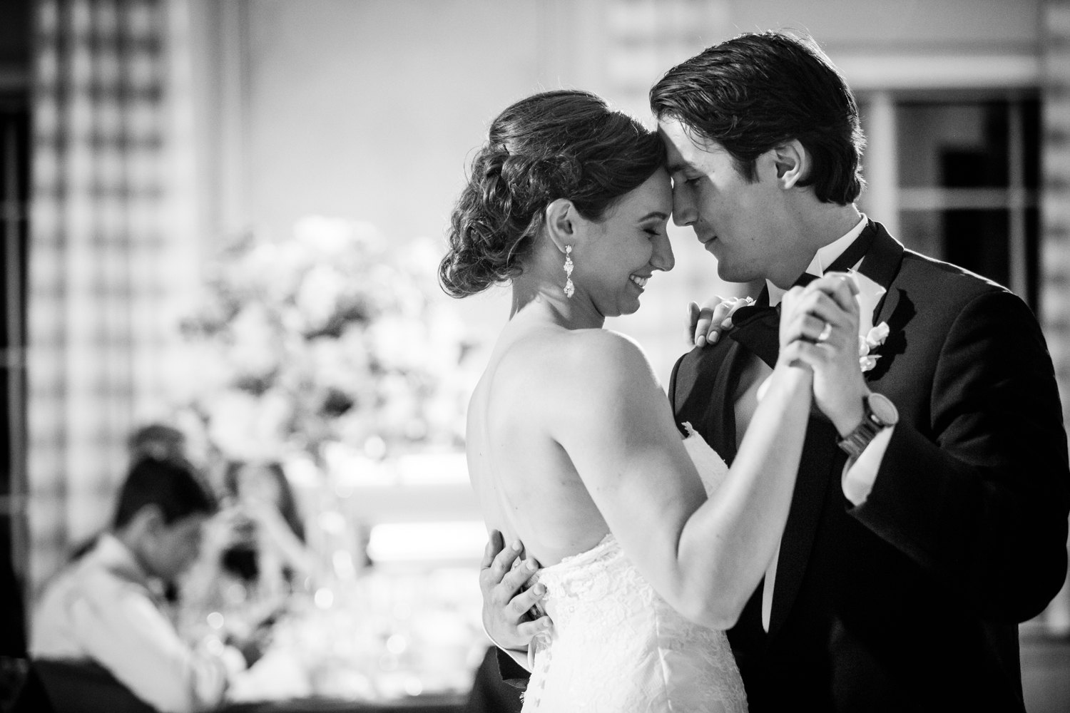 A bride and groom share their first dance during a Glen Club wedding reception. 