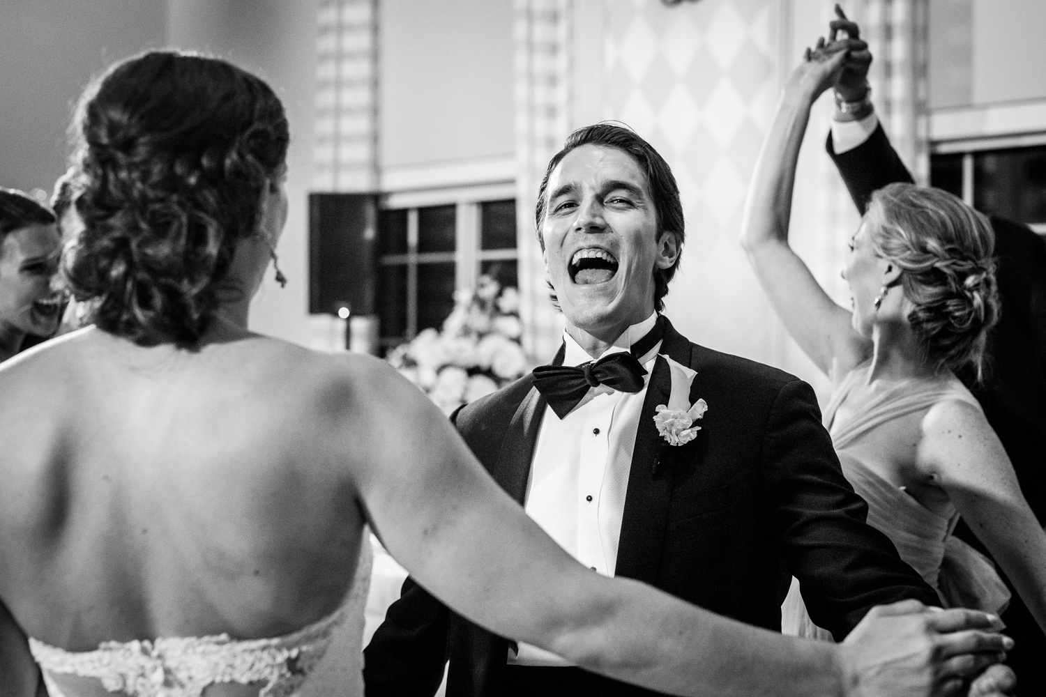 A groom dances with his bride during a Glen Club wedding reception. 