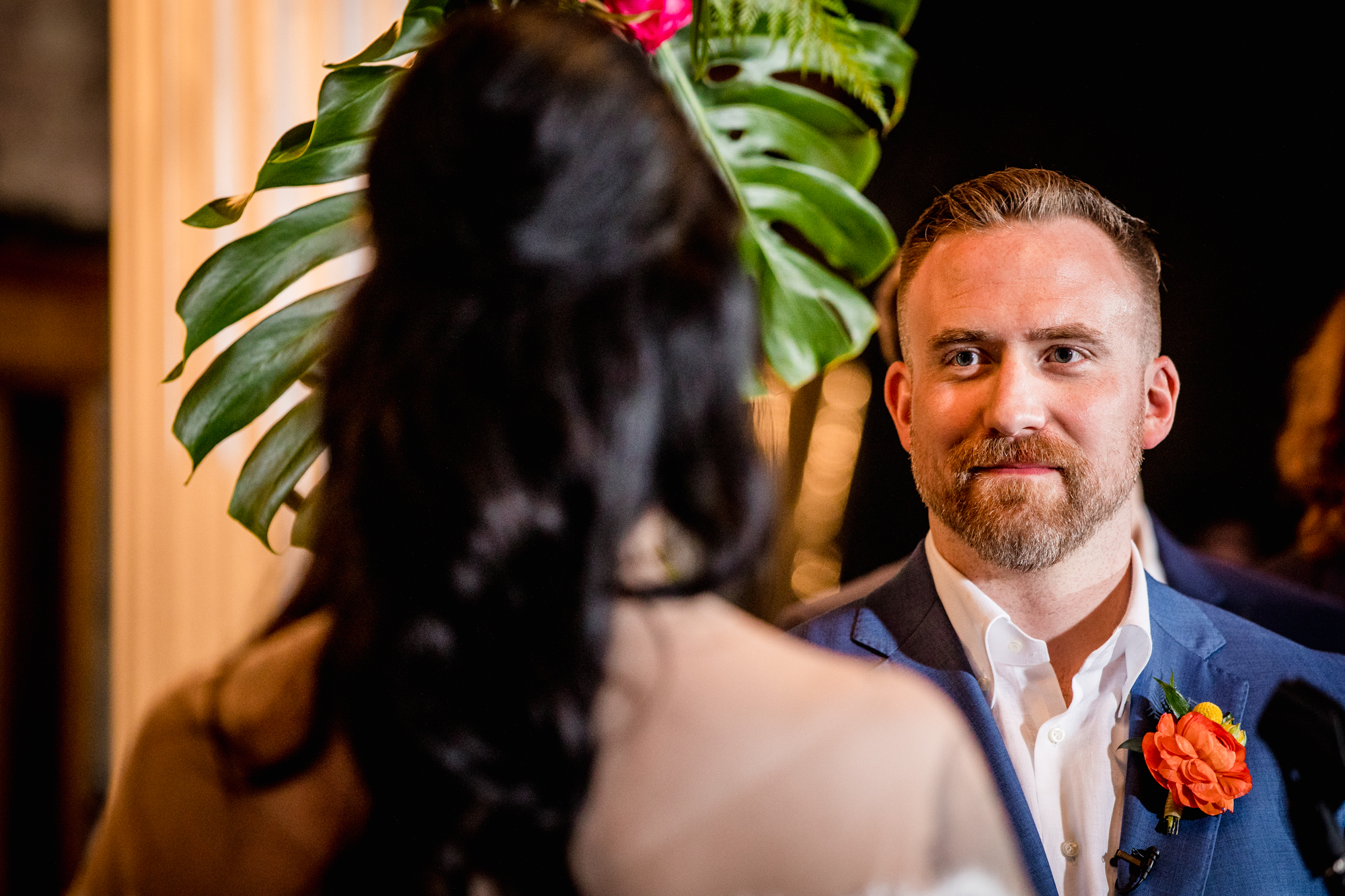 A groom looks at his bride during a Salvage One wedding ceremony in Chicago. 